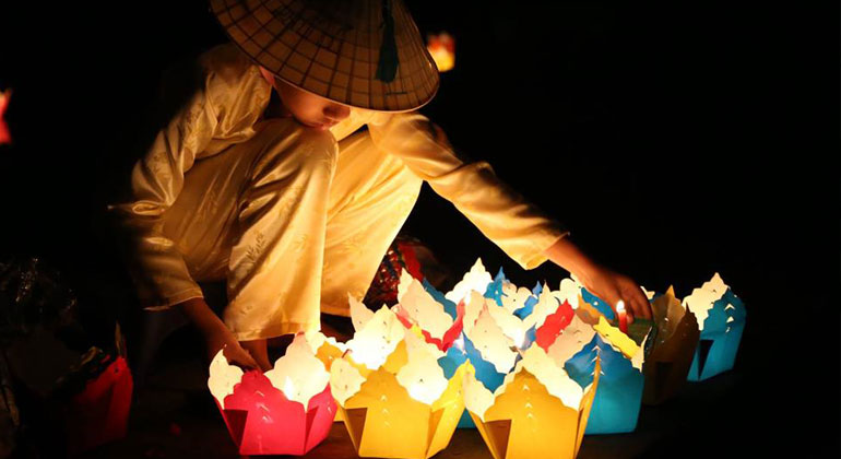 Praying on Full Moon day in Hoi An